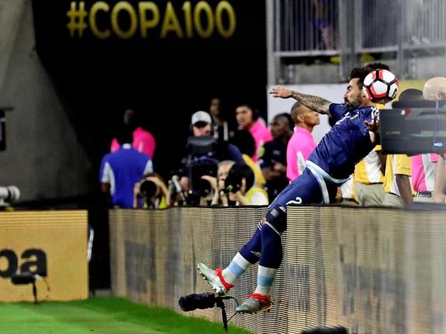 Lavezzi flips over the boards during the Copa America semifinal match against the United States. (Reuters via USA Today Sports) Lavezzi flips over the boards during the Copa America semifinal match against the United States. (Reuters via USA Today Sports)