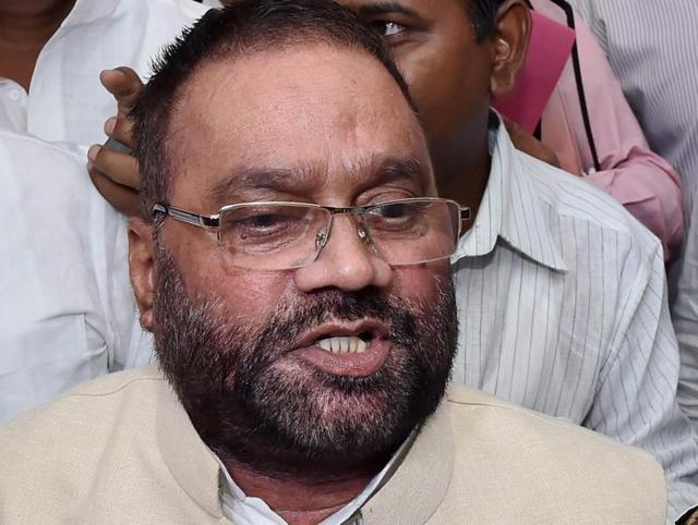 Swami Prasad Maurya shaking hands with SP leader Azam Khan in Lucknow after quitting BSP on Wednesday. (PTI) Swami Prasad Maurya shaking hands with SP leader Azam Khan in Lucknow after quitting BSP on Wednesday. (PTI)