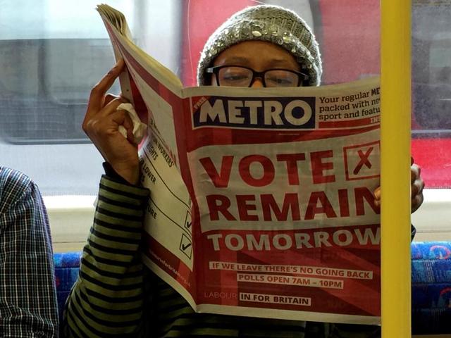 A woman reads a newspaper on the underground in London with a 'vote remain' advert for the BREXIT referendum, Britain June 22, 2016. (Reuters Photo) A woman reads a newspaper on the underground in London with a 'vote remain' advert for the BREXIT referendum, Britain June 22, 2016. (Reuters Photo)