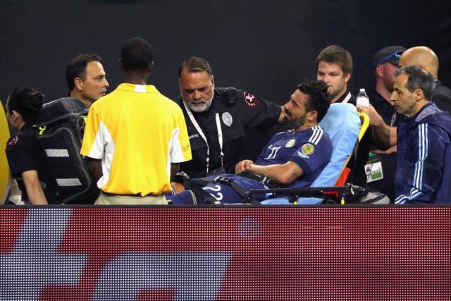 Ezequiel Lavezzi of Argentina is taken off the field by medical staff after falling over a barricade in the second half against the United States. (AFP Photo) Ezequiel Lavezzi of Argentina is taken off the field by medical staff after falling over a barricade in the second half against the United States. (AFP Photo)