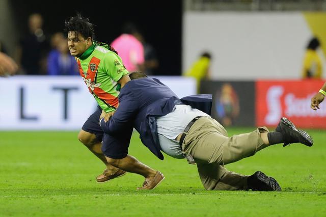 A fan is tackled by security after a 2016 Copa America Centenario semifinal match between Argentina and the United States. (AFP Photo)