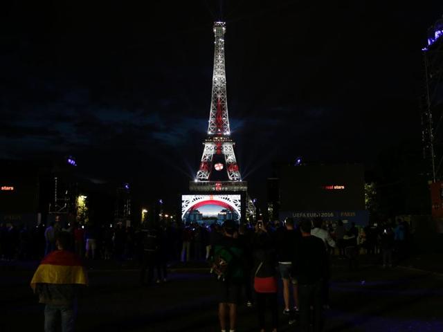 The Eiffel Tower is lit with the colours of England's flag. (AFP Photo) 