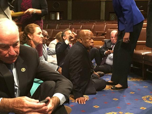 This photo provided by Rep John Yarmuth shows Democrat members of Congress, including Rep John Lewis (center), participate in a sit-down protest seeking a a vote on gun control measures on Wednesday. (AP) This photo provided by Rep John Yarmuth shows Democrat members of Congress, including Rep John Lewis (center), participate in a sit-down protest seeking a a vote on gun control measures on Wednesday. (AP)