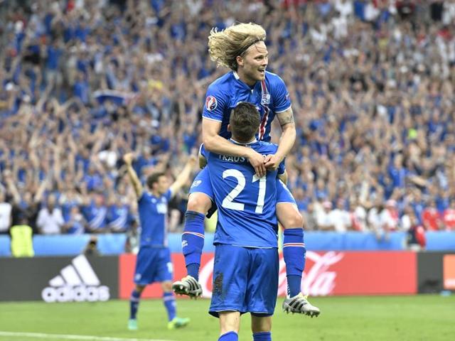 Iceland's Arnor Ingvi Traustason, bottom, holds teammate Birkir Bjarnason as they celebrate their win. (AP)