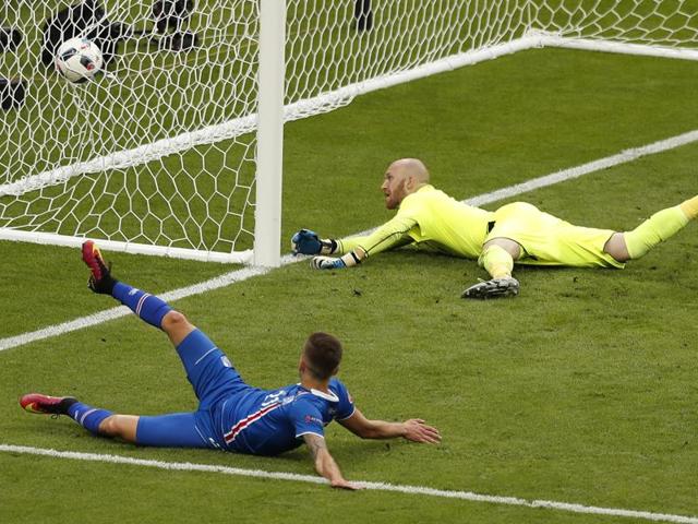 Iceland's Arnor Ingvi Traustason, bottom, scores his side's winning goal in the dying minutes of the match. (AP)
