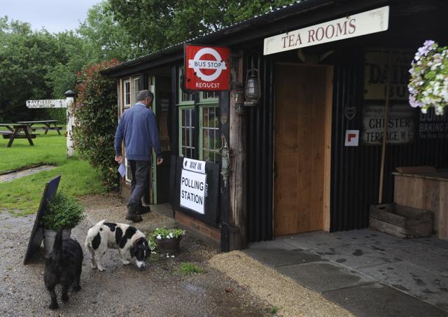 Gary Howard, owner of the Little Braxted Bakery in Little Braxted, Essex, Britain arrives at the polling station set up in his own tea rooms by the local council on June 23, 2016. (AP) Gary Howard, owner of the Little Braxted Bakery in Little Braxted, Essex, Britain arrives at the polling station set up in his own tea rooms by the local council on June 23, 2016. (AP)