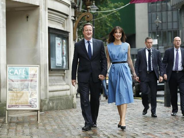 Britain's Prime Minister David Cameron and his wife Samantha arrive to vote in the EU referendum in London. (AP Photo) 