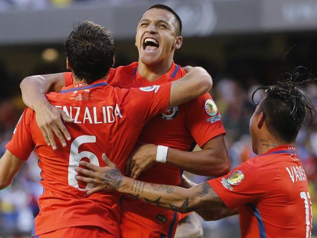 Chile's Jose Pedro Fuenzalida (6) celebrates his goal as he jumps in the arms of Chile's Eduardo Vargas (11). (AP Photo) Chile's Jose Pedro Fuenzalida (6) celebrates his goal as he jumps in the arms of Chile's Eduardo Vargas (11). (AP Photo)