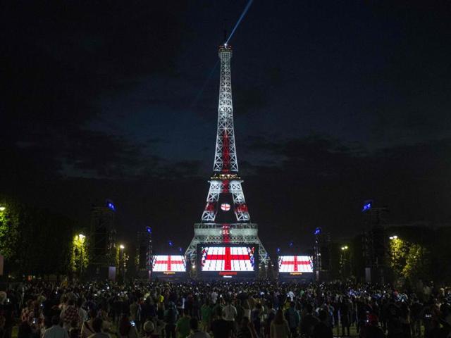 The Eiffel Tower is lit up with the England flag’s colours during a football match between England and Russia, in Paris. (AFP Photo) 