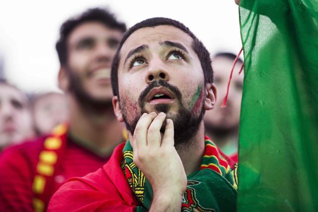 A Portugal supporter reacts as he watches in a fan zone in Paris the Euro 2016 football match between Portugal and Hungary. (AFP Photo) A Portugal supporter reacts as he watches in a fan zone in Paris the Euro 2016 football match between Portugal and Hungary. (AFP Photo)