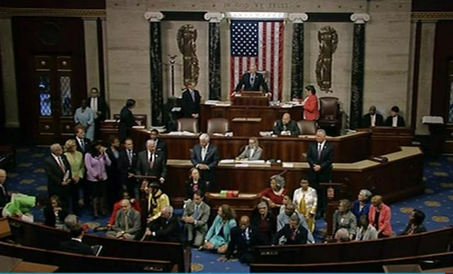 In this frame grab taken from AP video Georgia Rep. John Lewis, center, leads a sit-in of more than 200 Democrats in demanding a vote on measures to expand background checks and block gun purchases by some suspected terrorists in the aftermath of last week's massacre in Orlando, Florida, that killed 49 people in a gay nightclub. (AP Photo) In this frame grab taken from AP video Georgia Rep. John Lewis, center, leads a sit-in of more than 200 Democrats in demanding a vote on measures to expand background checks and block gun purchases by some suspected terrorists in the aftermath of last week's massacre in Orlando, Florida, that killed 49 people in a gay nightclub. (AP Photo)