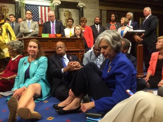 A photo shot and tweeted from the floor of the US House of Representatives by US House Rep. Katherine Clark shows Democratic members of the House staging a sit-in on the House floor ‘to demand action on common sense gun legislation’. (Reuters) A photo shot and tweeted from the floor of the US House of Representatives by US House Rep. Katherine Clark shows Democratic members of the House staging a sit-in on the House floor ‘to demand action on common sense gun legislation’. (Reuters)