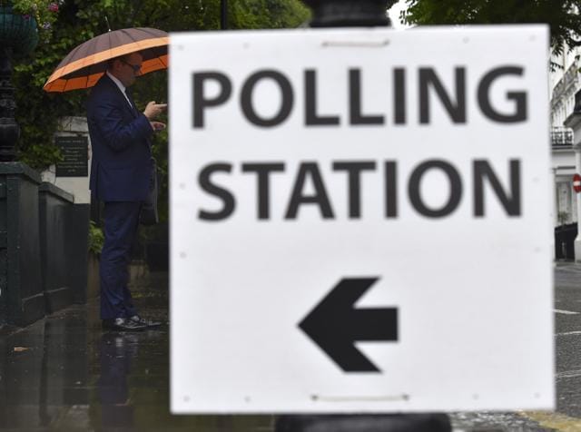 A man carries an umbrella outside a polling station for the Referendum on the European Union in west London in Britain on June 23, 2016. (REUTERS) A man carries an umbrella outside a polling station for the Referendum on the European Union in west London in Britain on June 23, 2016. (REUTERS)