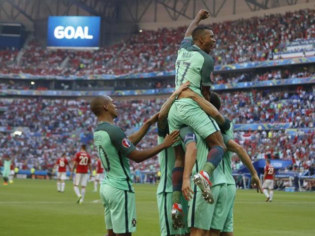 Nani, top, celebrates with teammates after Cristiano Ronaldo scored Portugal's second goal. (AP) Nani, top, celebrates with teammates after Cristiano Ronaldo scored Portugal's second goal. (AP)