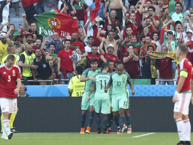 Cristiano Ronaldo celebrates with teammates after scoring. (AP) Cristiano Ronaldo celebrates with teammates after scoring. (AP)