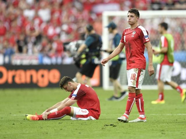 Austria's Alessandro Schoepf, right, and Aleksander Dragovic are dejected after the loss eliminated them from Euro 2016. (AP)