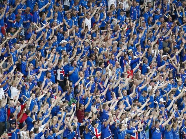 Iceland's fans cheer for their team. (AP)