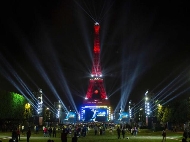 The Eiffel Tower is lit in Turkey flag's colours, as seen from the fan zone. (AFP Photo) 