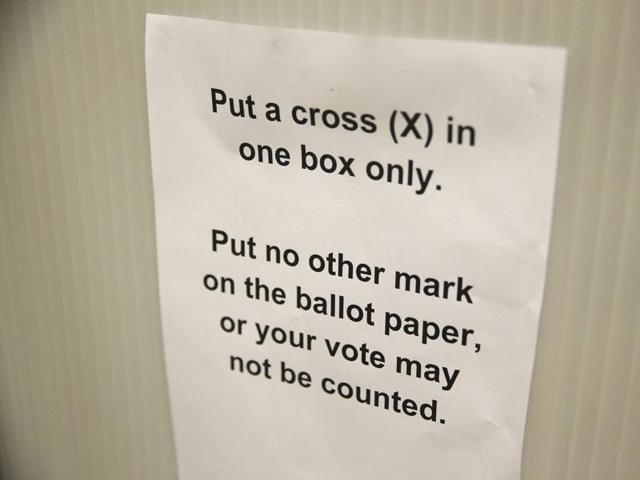 A sign gives voting instructions in a voting booth at a polling station for the Referendum on the European Union in north London. (REUTERS) 