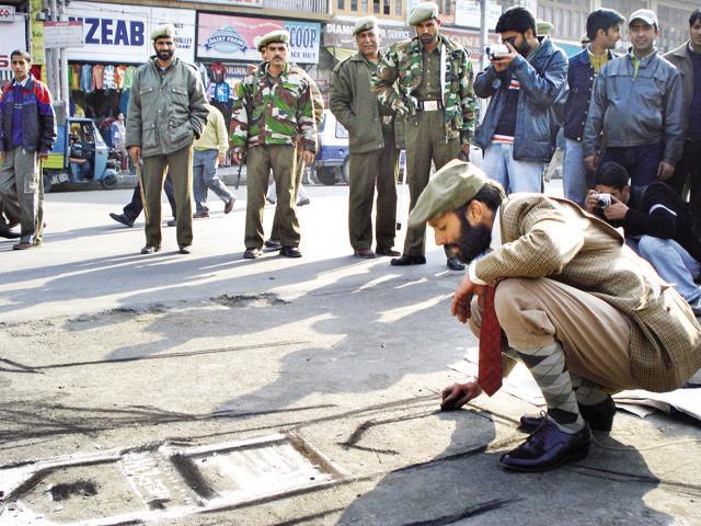 Nikhil Chopra, one of the best known Indian performance artists in the world, makes a statement by drawing at Srinagar’s iconic Lal Chowk , dressed as a dandy for his series (Photo courtesy: The artist)