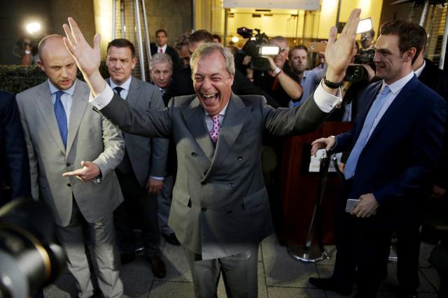 Nigel Farage, the leader of the UK Independence Party, celebrates and poses for photographers as he leaves a "Leave.EU" organization party for the British European Union membership referendum in London, Friday, June 24, 2016. (AP Photo) Nigel Farage, the leader of the UK Independence Party, celebrates and poses for photographers as he leaves a "Leave.EU" organization party for the British European Union membership referendum in London, Friday, June 24, 2016. (AP Photo)