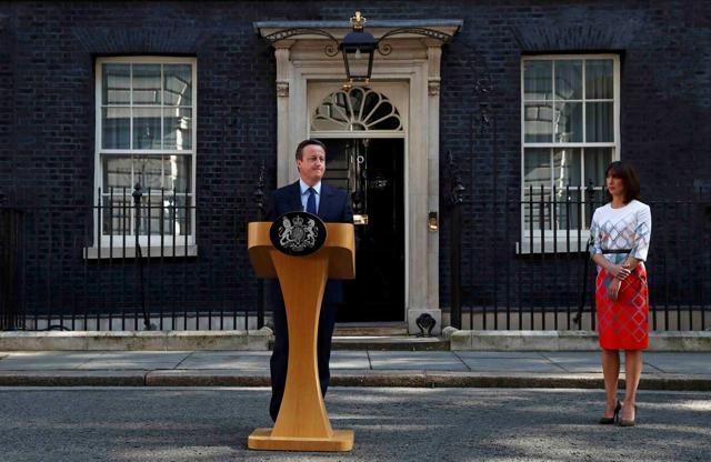 Britain's Prime Minister David Cameron speaks after Britain voted to leave the European Union, as his wife Samantha watches outside Number 10 Downing Street in London on Friday. (REUTERS) Britain's Prime Minister David Cameron speaks after Britain voted to leave the European Union, as his wife Samantha watches outside Number 10 Downing Street in London on Friday. (REUTERS)