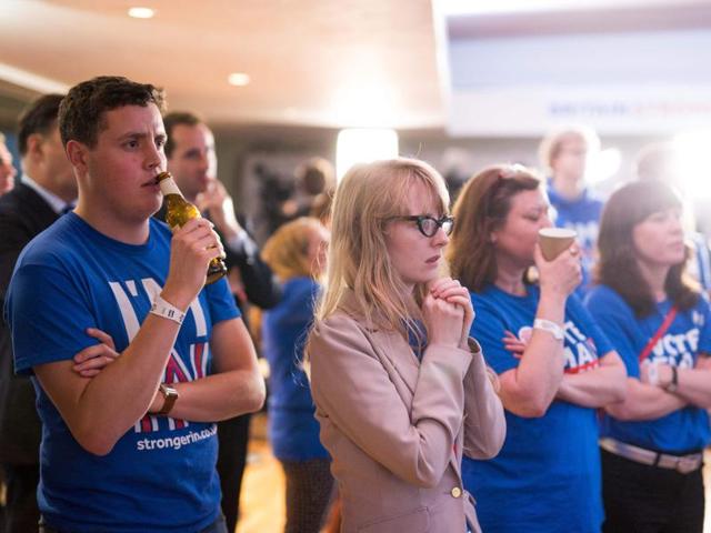 Supporters of the 'Stronger In' Campaign watch the results of the EU referendum being announced at a results party at the Royal Festival Hall in London on Friday. (AFP)