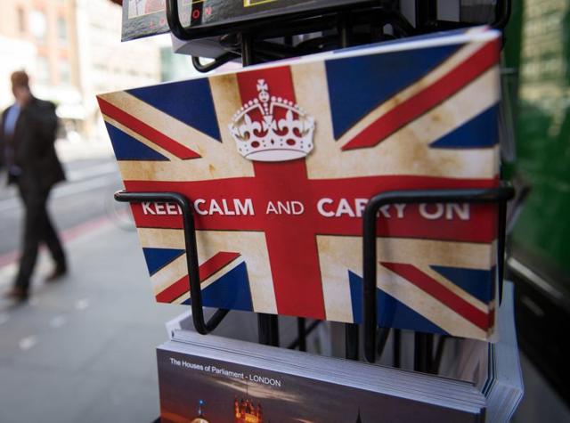 Postcards featuring the World War II British slogan “Keep Calm and Carry On” are seen outside a newsagents in London. Britain voted to break away from the European Union, toppling Prime Minister David Cameron and dealing a thunderous blow to the 60-year-old bloc that sent world markets plunging.(AFP Photo) Postcards featuring the World War II British slogan “Keep Calm and Carry On” are seen outside a newsagents in London. Britain voted to break away from the European Union, toppling Prime Minister David Cameron and dealing a thunderous blow to the 60-year-old bloc that sent world markets plunging.(AFP Photo)