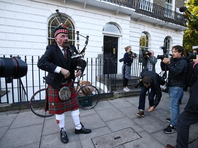 A Scottish bagpiper plays outside the house of former London Mayor and Vote Leave campaigner Boris Johnson in London. (AFP)