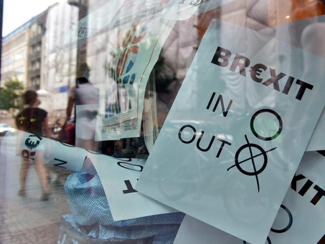 A poster featuring a Brexit vote ballot with "out" tagged is on display at a book shop window in Berlin on June 24, 2016.(AFP) A poster featuring a Brexit vote ballot with "out" tagged is on display at a book shop window in Berlin on June 24, 2016.(AFP)