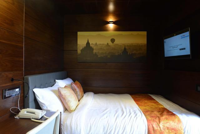 The bedroom area of a refurbished shipping container. (AFP)