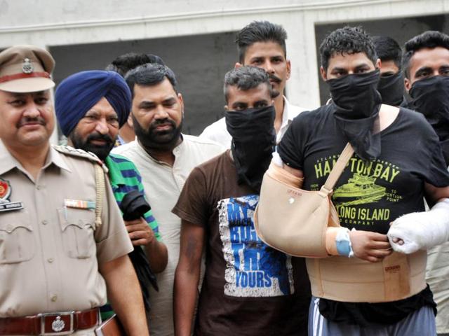 Gangster Sukha Barewal and his accomplices in police custody in Ludhiana on Thursday.(JS Grewal/HT Photo)