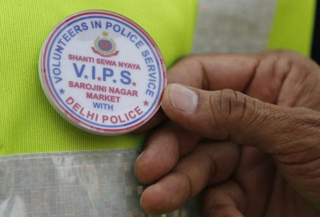 The team of 60 men sports neon green jackets and VIPS (Volunteers in Police Service) badges bearing the Delhi Police logo. (Sanchit Khanna / HT Photo) The team of 60 men sports neon green jackets and VIPS (Volunteers in Police Service) badges bearing the Delhi Police logo. (Sanchit Khanna / HT Photo)