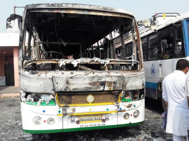 A private bus burnt at Malerkotla bus stand on Saturday. (HT Photo) A private bus burnt at Malerkotla bus stand on Saturday. (HT Photo)