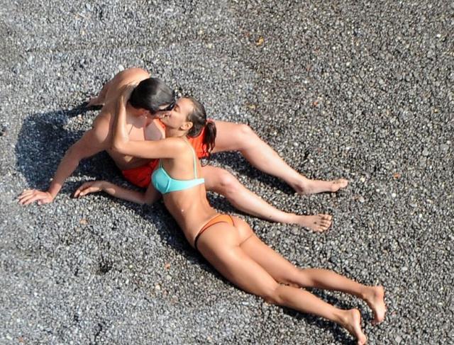Irina Shayk and Bradley Cooper hanging out on a beach in the initial days of their romance. (Twitter)