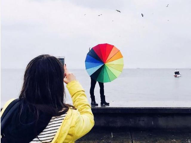 A colourful umbrella being clicked at Caddebostan Sahili, Turkey. (Instagram/erbilkececi)