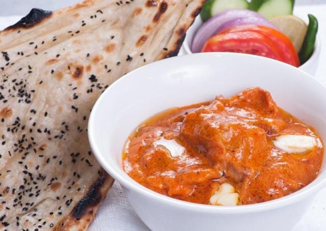 To make Delhi Pavilion’s signature butter chicken, chef Vipul Gupta uses desi tomatoes rather than the usual red one