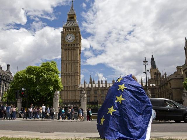 A demonstrator draped in an EU flag sits on floor during a protest against the outcome of the UK’s June 23 referendum on the European Union. (AFP Photo) A demonstrator draped in an EU flag sits on floor during a protest against the outcome of the UK’s June 23 referendum on the European Union. (AFP Photo)