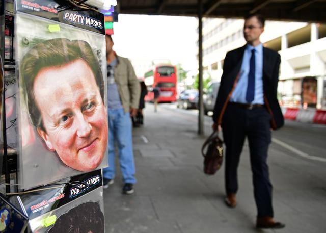 Novelty face masks including one of British Prime Minister David Cameron are displayed for sale on a street vendor's stall in London on Friday. (AFP) Novelty face masks including one of British Prime Minister David Cameron are displayed for sale on a street vendor's stall in London on Friday. (AFP)