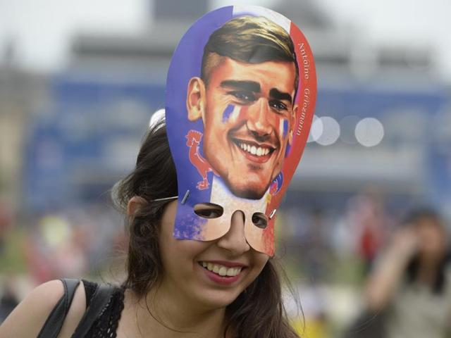 A French supporter smiles with a mask representing Antoine Griezmann inside the fan zone ahead of the first football matches of the Euro 2016 football tournament on June 10, 2016 in Paris. (AFP PHOTO) A French supporter smiles with a mask representing Antoine Griezmann inside the fan zone ahead of the first football matches of the Euro 2016 football tournament on June 10, 2016 in Paris. (AFP PHOTO)