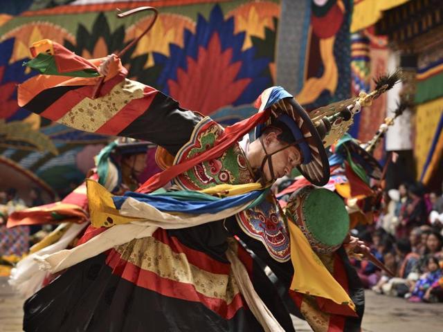 Monks perform traditional mask dance, a physical manifestation of Guru Padmasambhava’s life. (Gurinder Osan/HT PHOTO)