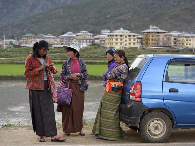 Women prepare to return after working on a paddy field in Paro, Bhutan, on Tuesday, June 14, 2016. (Gurinder Osan/HT PHOTO)