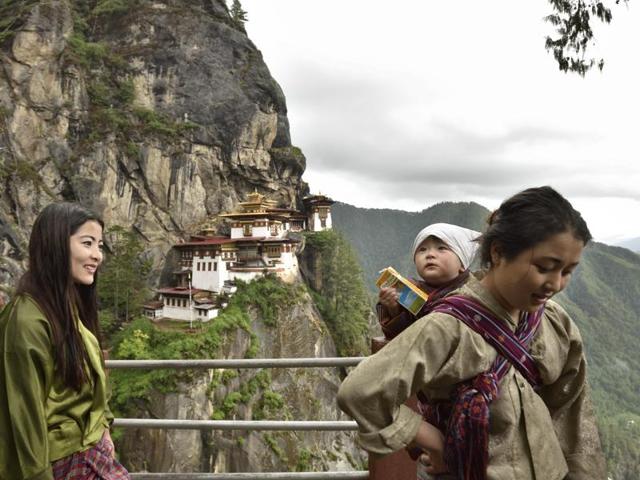 A family returns after paying obeisance at the Taksang Monastery (or Tiger’s Nest), where Guru Padmasambhava meditated, on Guru Padmasambhava’s birth anniversary in Paro. (Gurinder Osan/HT PHOTO)