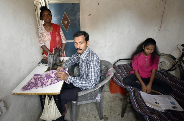 Sushant Sikdar, a tailor from Noida says that if the prices rise any further their daughter Prijita will have to do without her after-school tutorial classes. (Ravi Choudhary/HT PHOTO) Sushant Sikdar, a tailor from Noida says that if the prices rise any further their daughter Prijita will have to do without her after-school tutorial classes. (Ravi Choudhary/HT PHOTO)