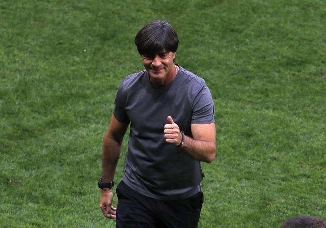 Lukas Podolski defends Joachim Loew, above, after the Germany coach was caught scratching his genitals by television cameras. (AP)