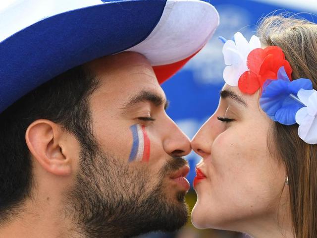 A man and a woman supporting France kiss prior to the Euro 2016 group A football match between France and Romania at Stade de France. (AFP Photo) A man and a woman supporting France kiss prior to the Euro 2016 group A football match between France and Romania at Stade de France. (AFP Photo)