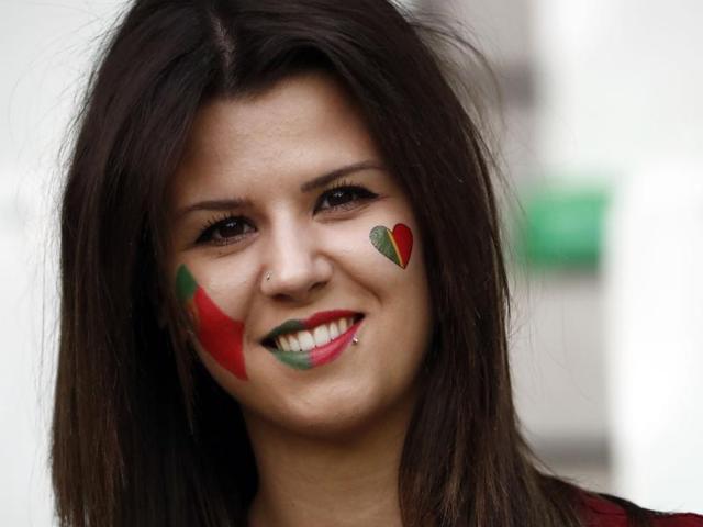 A Portugal supporter smiles prior to the Euro 2016 group F football match between Portugal and Iceland at the Geoffroy-Guichard stadium in Saint-Etienne. (AFP Photo) A Portugal supporter smiles prior to the Euro 2016 group F football match between Portugal and Iceland at the Geoffroy-Guichard stadium in Saint-Etienne. (AFP Photo)