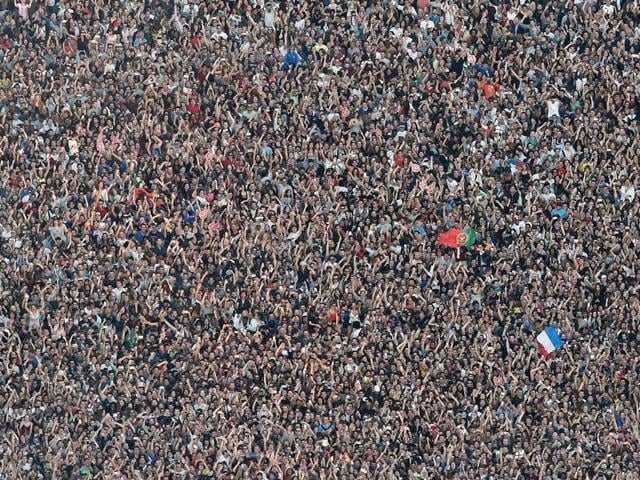 This picture taken from the Eiffel Tower on June 9, 2016 shows the Paris fan zone on the Champs de Mars during the opening concert of the Paris fan zone one, a day before the start of the Euro 2016 football championship, in Paris. (AFP PHOTO) This picture taken from the Eiffel Tower on June 9, 2016 shows the Paris fan zone on the Champs de Mars during the opening concert of the Paris fan zone one, a day before the start of the Euro 2016 football championship, in Paris. (AFP PHOTO)