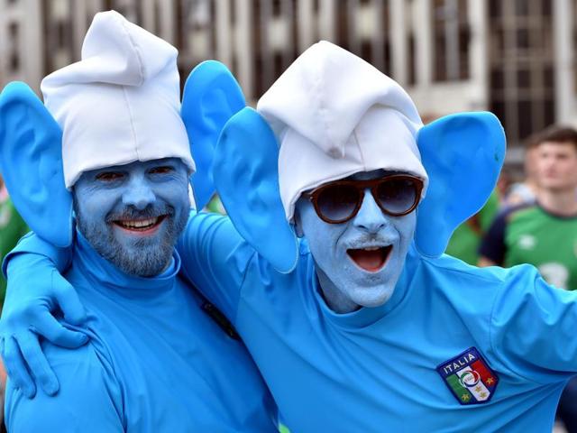 Two Italy's supporters dressed as smurfs cartoon character pose as they gather with other football fans in the streets of Lille on June 22, 2016, ahead of the Euro 2016 group E football match between Italy and Ireland. (AFP Photo) Two Italy's supporters dressed as smurfs cartoon character pose as they gather with other football fans in the streets of Lille on June 22, 2016, ahead of the Euro 2016 group E football match between Italy and Ireland. (AFP Photo)