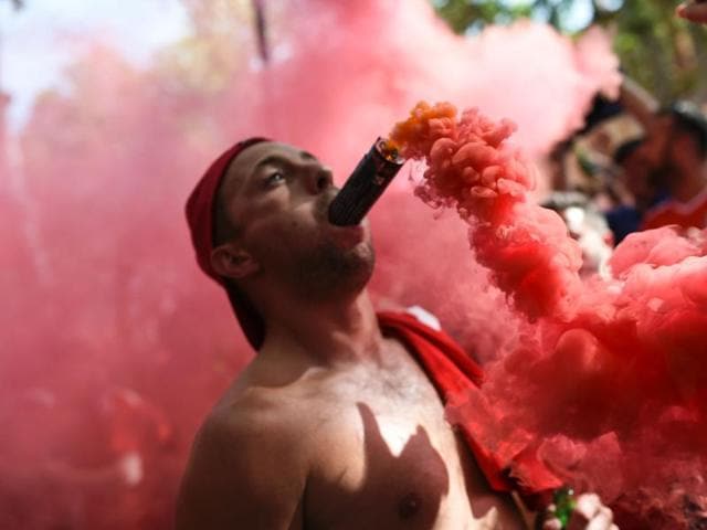 A Wales' supporter cheers with a flare in his mouth downtown Toulouse. (AFP Photo) A Wales' supporter cheers with a flare in his mouth downtown Toulouse. (AFP Photo)